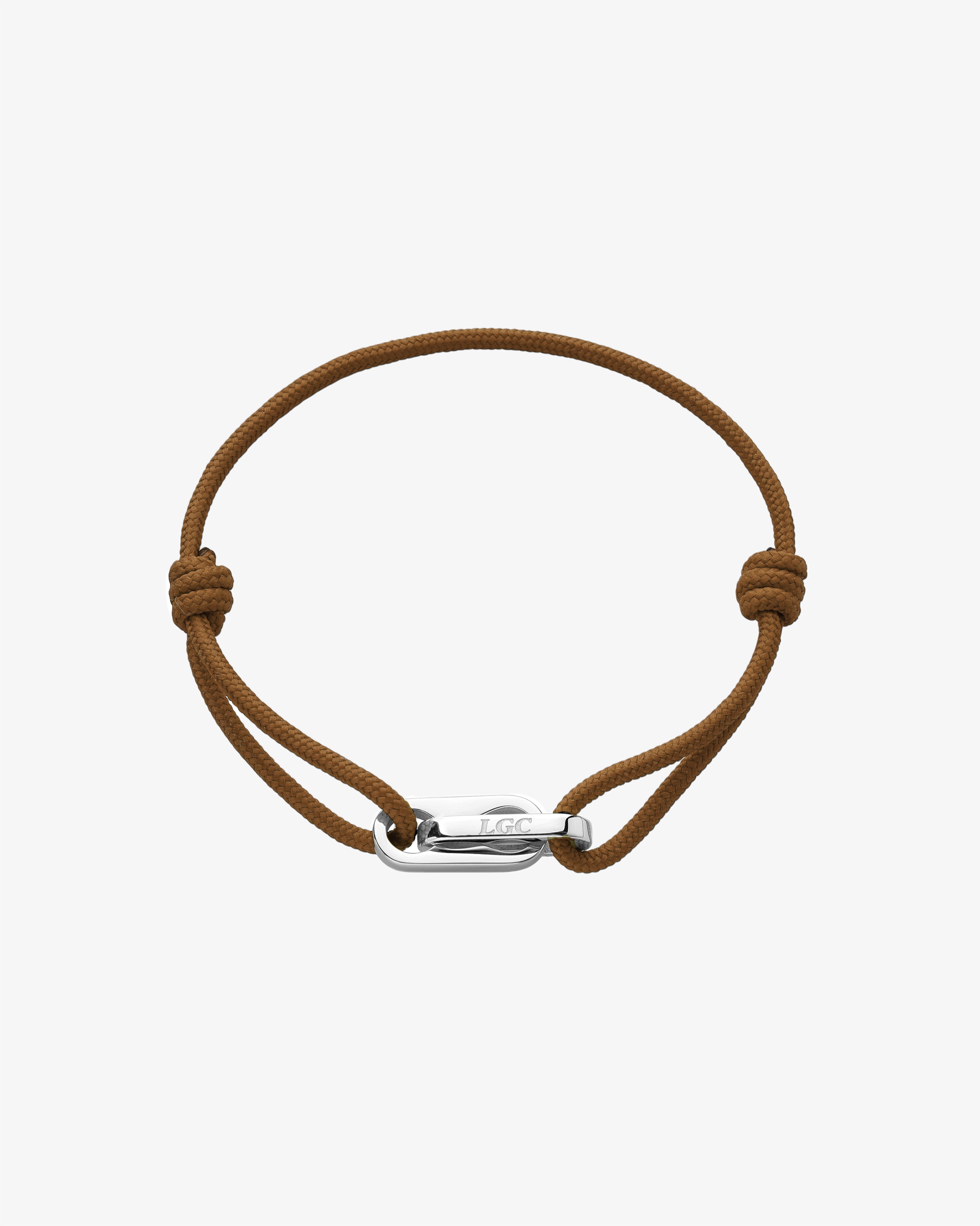 Atlantis silver bracelet with brown cord and a polished silver clasp engraved LGC.