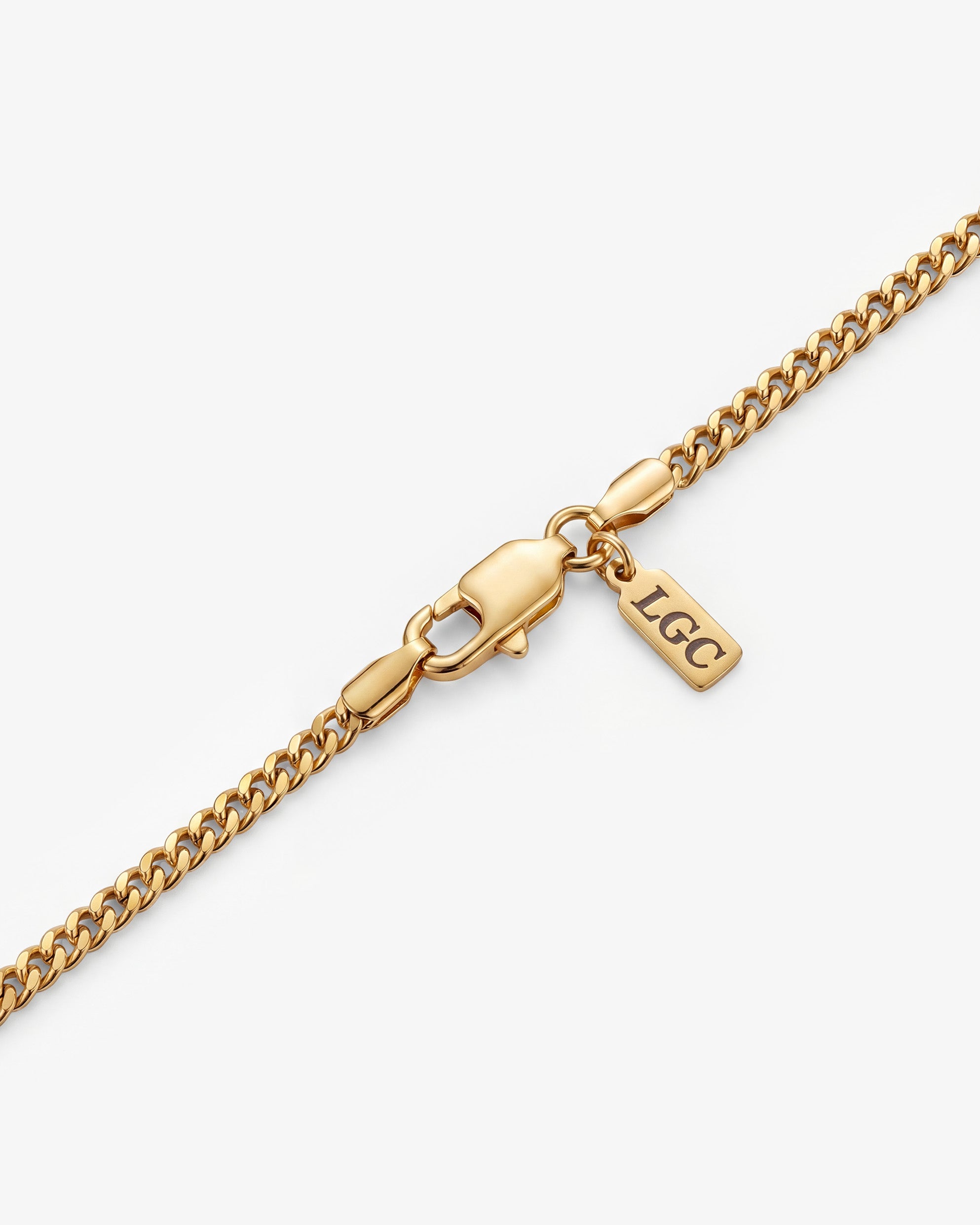 Close up of VOLT necklace collection showing gold and silver chains with bold rectangular gemstone pendants and sturdy clasps