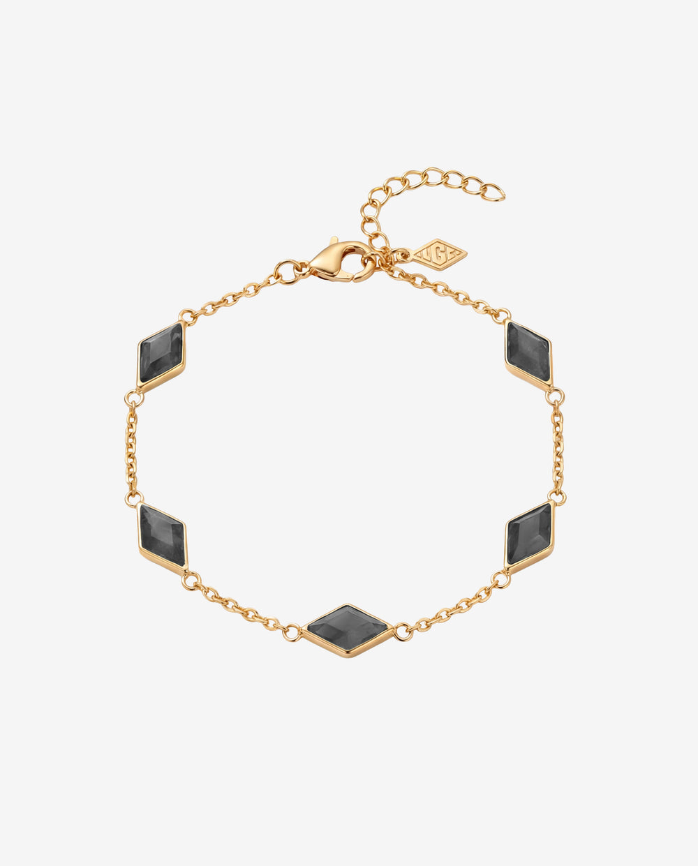 Pulsera dorada Amberes con piedras rectangulares negras engastadas en una delicada cadena.