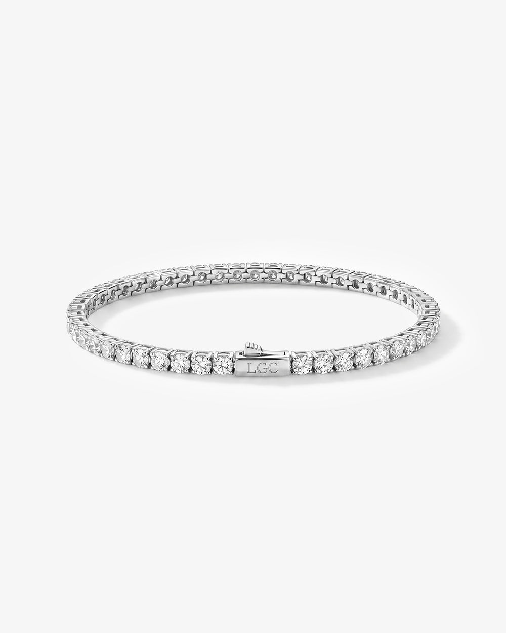Pulsera tennis plateada con fila de circonitas y cierre grabado LGC