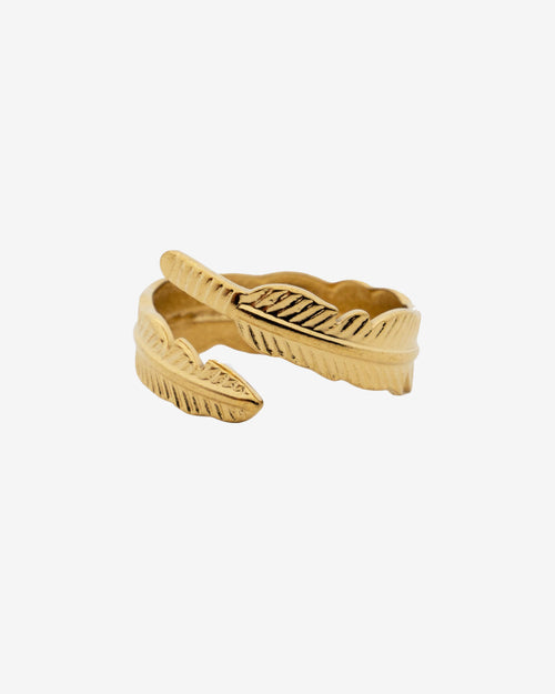 Close up of a Tahoe Gold Ring with a leaf textured edge on a white background